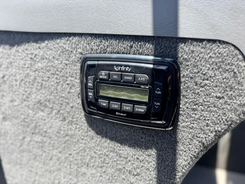 Slide: The Image of Infinity stereo system on 2013 Smoker Craft Ultima 172 boat dashboard. - 20