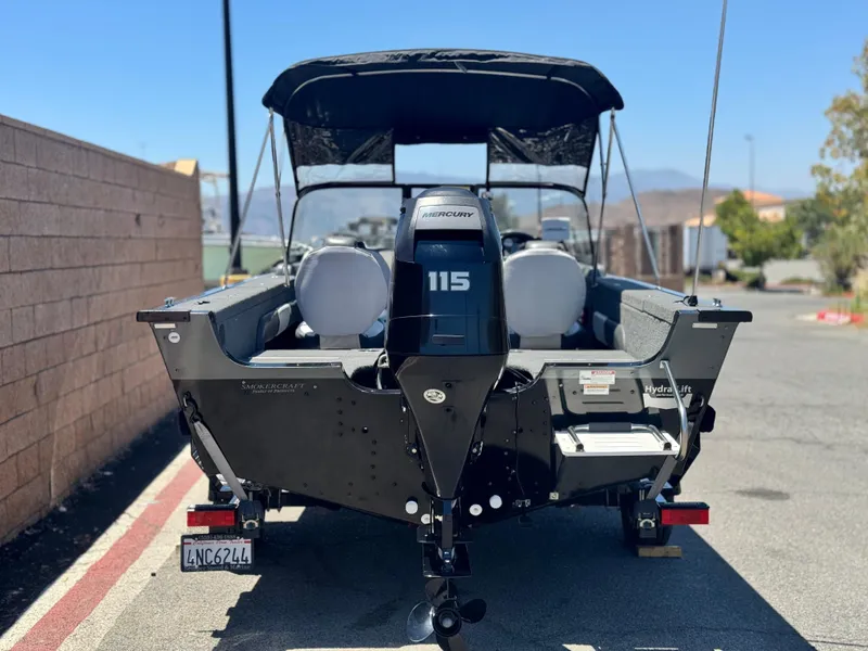 Slide: The Image of 2013 Smoker Craft Ultima 172 boat with Mercury 115 engine, parked outdoors. - 4