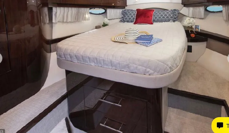 Slide: The Image of Luxurious interior of 2017 Regal 46 Sport Coupe with elegant bedding and decor. - 10