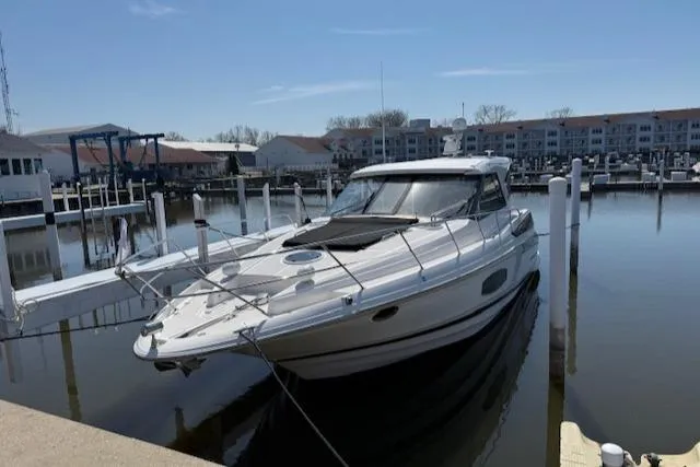 Slide: The Image of 2017 Regal 46 Sport Coupe docked at a marina under clear skies. - 19