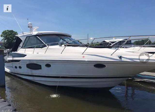 Slide: The Image of 2017 Regal 46 Sport Coupe yacht docked on a sunny day. - 2