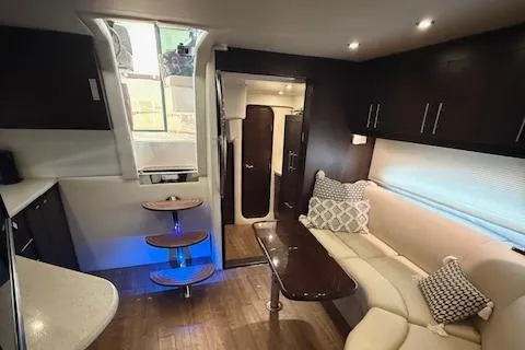 Slide: The Image of Interior of 2017 Regal 46 Sport Coupe with modern seating and ambient lighting. - 21