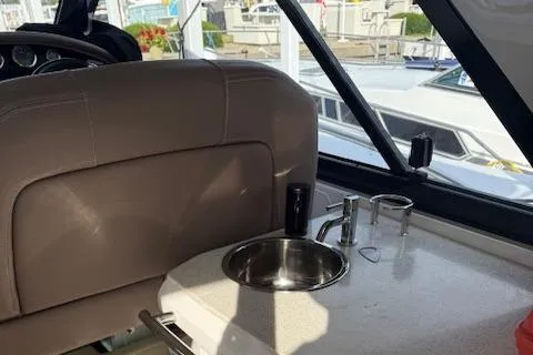 Slide: The Image of 2017 Regal 46 Sport Coupe interior with sink and seating area. - 25