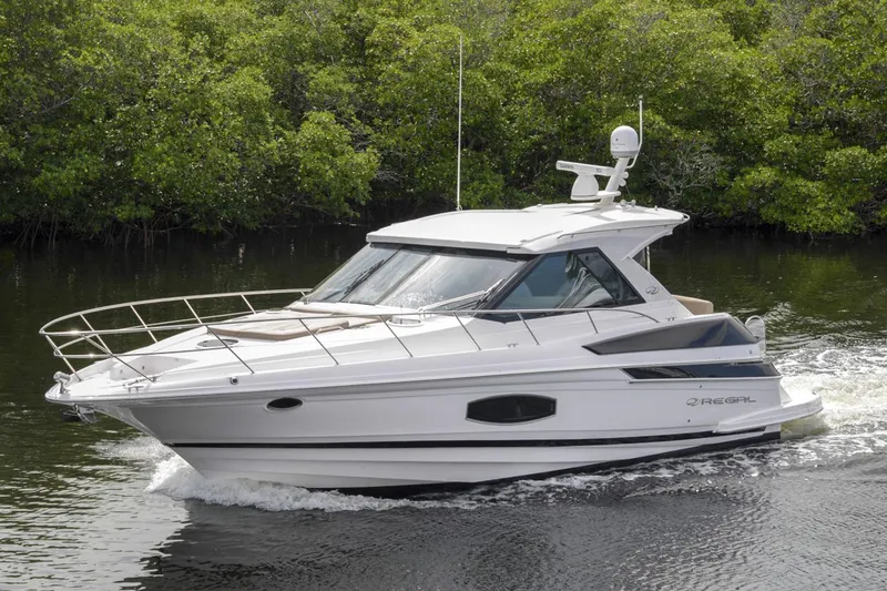 Slide: The Image of Manufacturer Provided Image: 2017 Regal 46 Sport Coupe cruising on a river. - 28