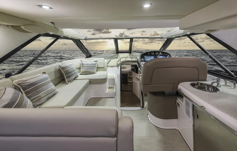 Slide: The Image of Manufacturer Provided Image: Interior of 2017 Regal 46 Sport Coupe yacht with luxurious seating and ocean view. - 32