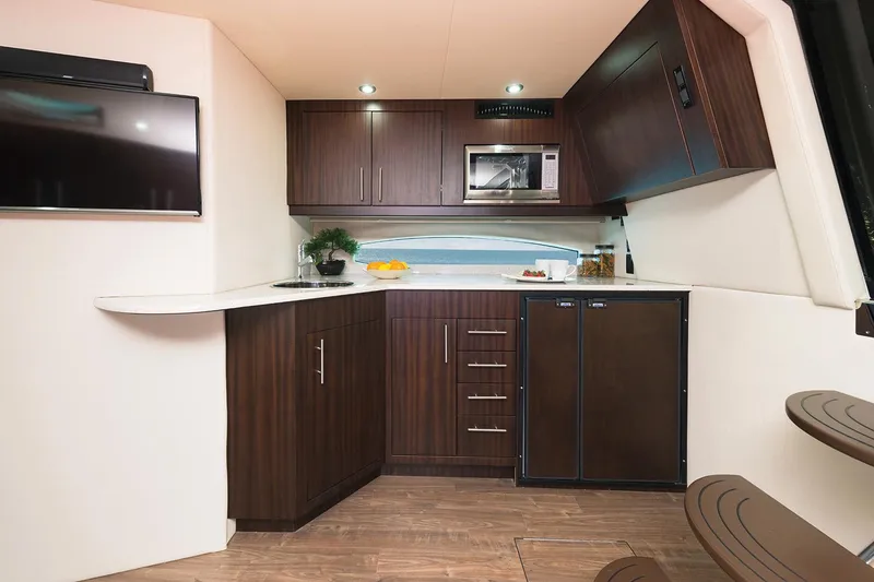 Slide: The Image of Manufacturer Provided Image: 2017 Regal 46 Sport Coupe kitchen with modern appliances and sleek cabinetry. - 35