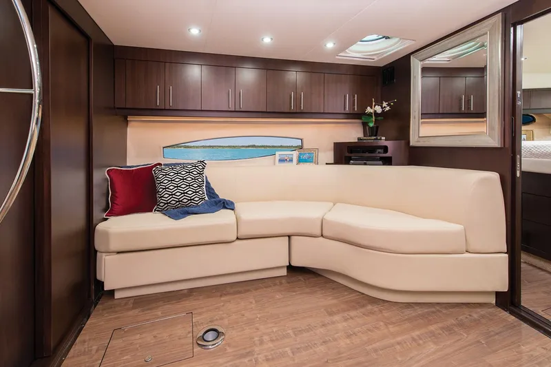 Slide: The Image of Manufacturer Provided Image: Luxurious interior of 2017 Regal 46 Sport Coupe with cream leather sofa and wooden cabinetry. - 37