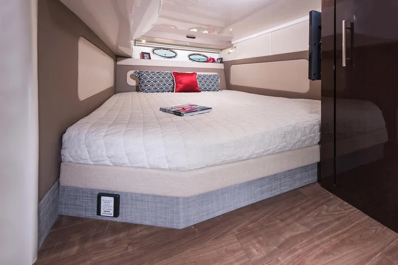 Slide: The Image of Manufacturer Provided Image: 2017 Regal 46 Sport Coupe bedroom with a cozy bed and modern decor. - 39