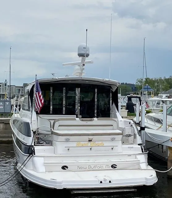 Slide: The Image of 2017 Regal 46 Sport Coupe yacht docked in New Buffalo, Michigan marina. - 4