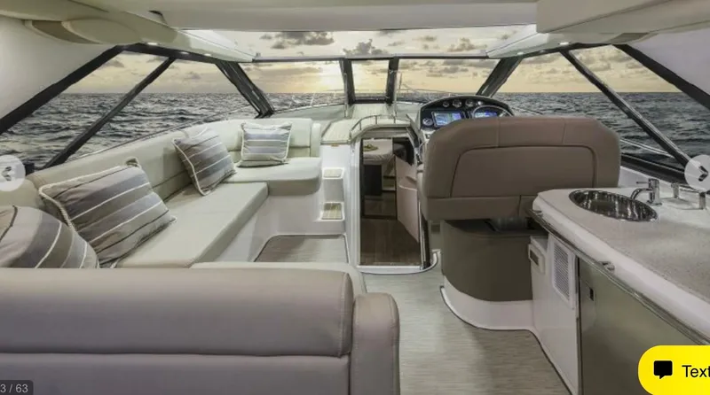 Slide: The Image of Luxurious interior of 2017 Regal 46 Sport Coupe yacht with ocean view. - 40