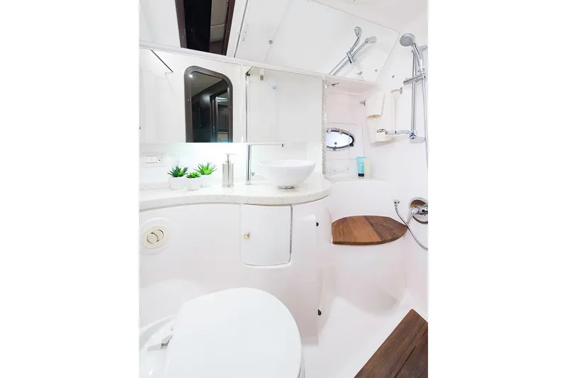 Slide: The Image of Manufacturer Provided Image: Modern bathroom in 2017 Regal 46 Sport Coupe yacht with sleek fixtures and wooden accents. - 41