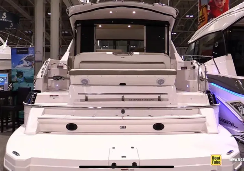 Slide: The Image of 2017 Regal 46 Sport Coupe yacht displayed at a boat show. - 5