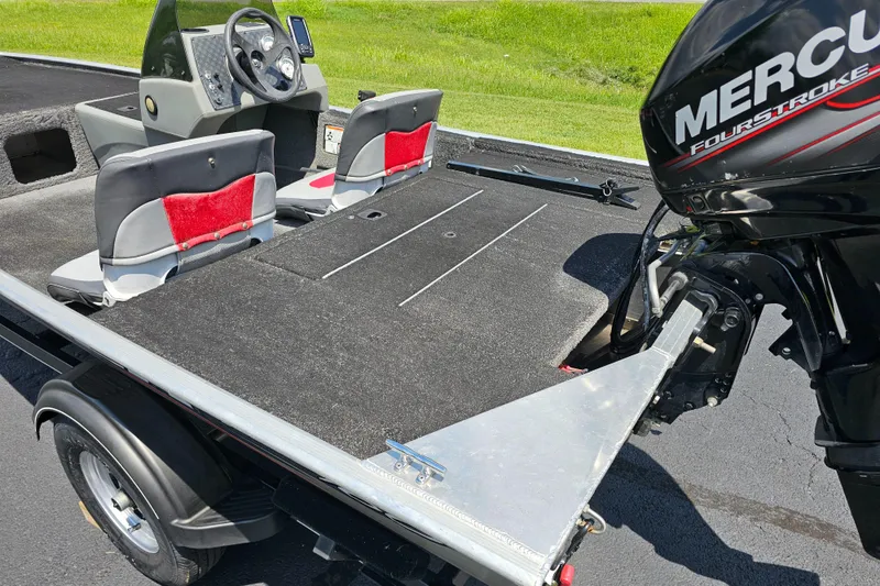Slide: The Image of 2016 Tracker PRO160 boat with Mercury FourStroke engine, featuring dual seats and steering console. - 9