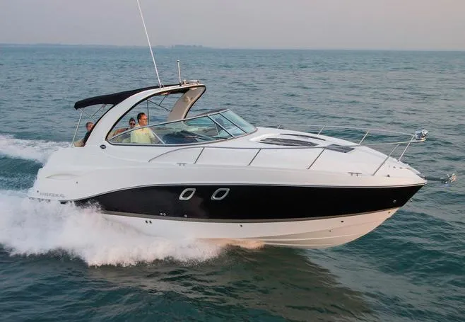 The Image of Manufacturer Provided Image: 2014 Rinker 310 Express Cruiser speeding on open water. - 0