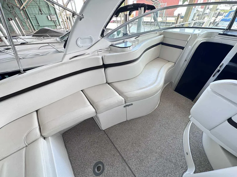 Slide: The Image of 2014 Rinker 310 Express Cruiser dashboard with steering wheel and control panel. - 10