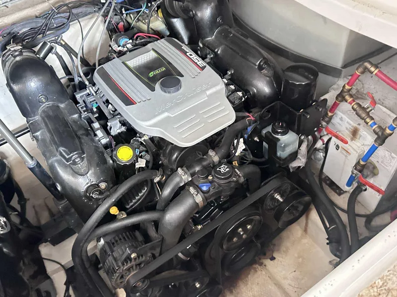 Slide: The Image of Control panel of a 2014 Rinker 310 Express Cruiser with gauges and switches. - 19