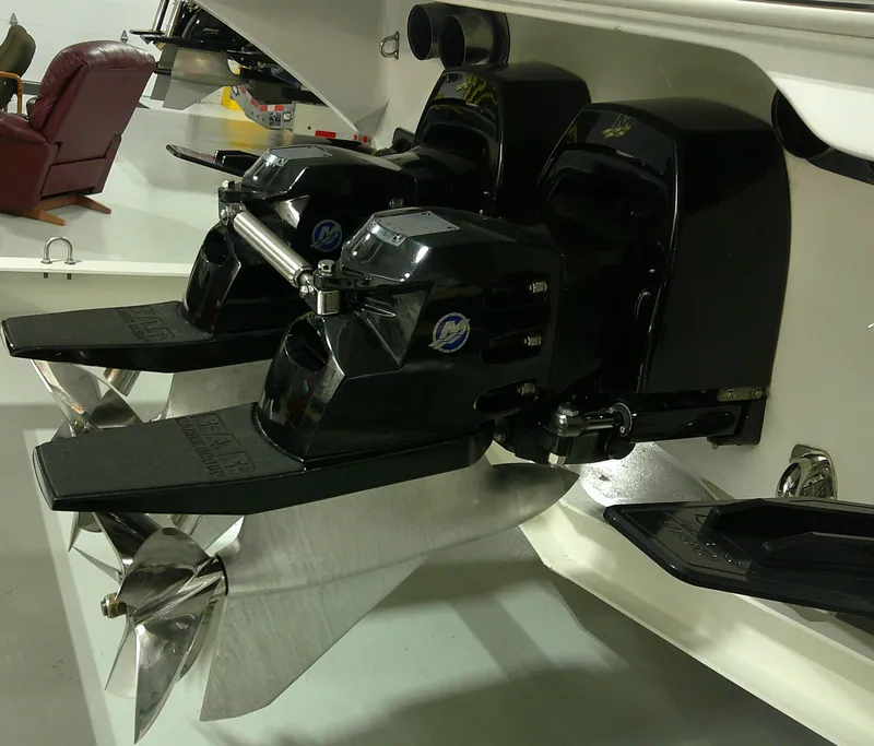 Slide: The Image of Twin outboard motors on a 1993 Fountain 47 boat, featuring stainless steel propellers. - 8