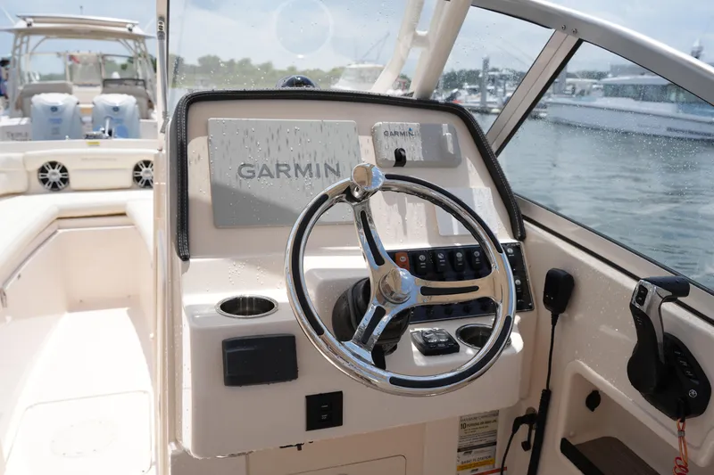 Slide: The Image of 2023 Grady-White Freedom 235 boat helm with Garmin navigation system. - 27