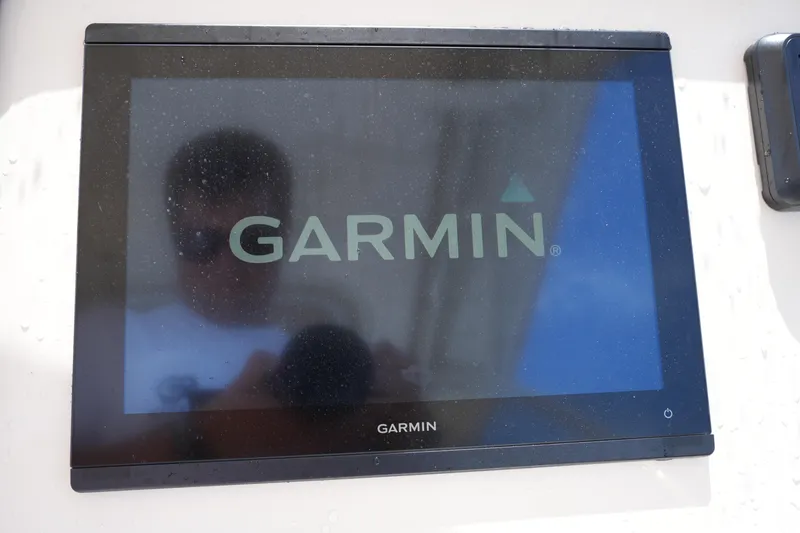 Slide: The Image of Garmin display screen on 2023 Grady-White Freedom 235 boat dashboard. - 29