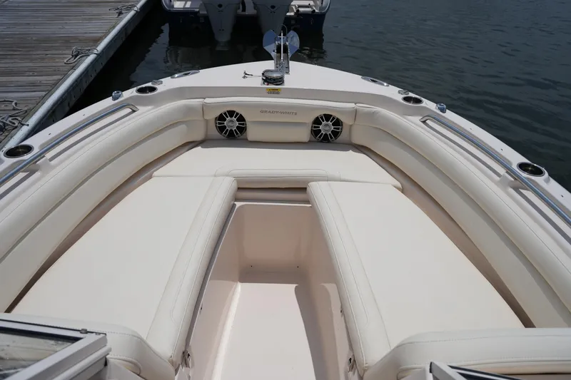 Slide: The Image of 2023 Grady-White Freedom 235 boat interior with cushioned seating and speakers. - 36