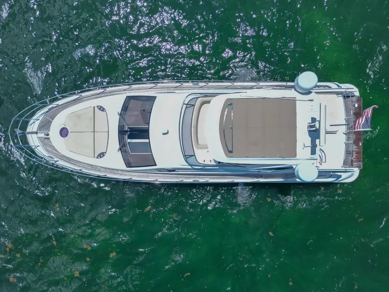 Slide: The Image of Aerial view of 2015 Azimut 54 Fly yacht on green water. - 15