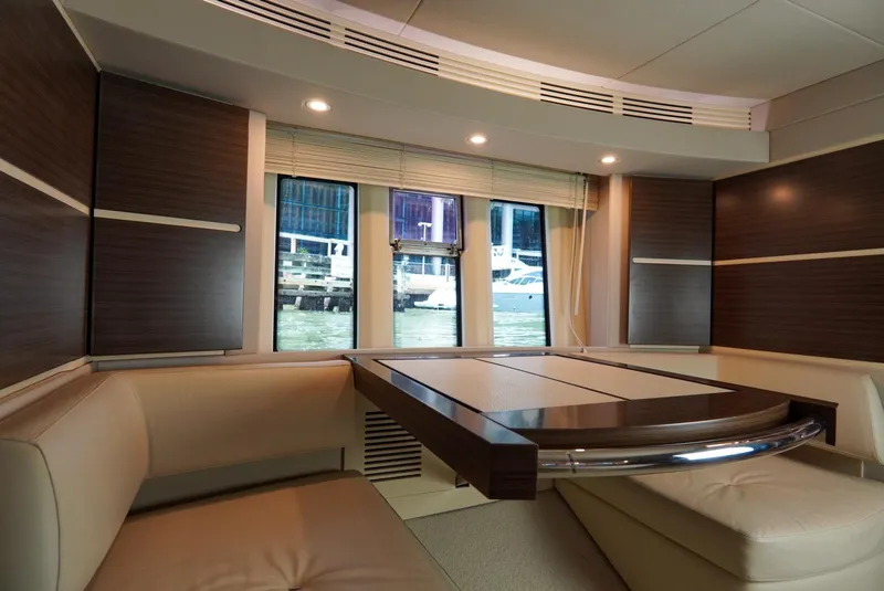 Slide: The Image of Luxurious interior of 2015 Azimut 54 Fly yacht with elegant seating and window view. - 49