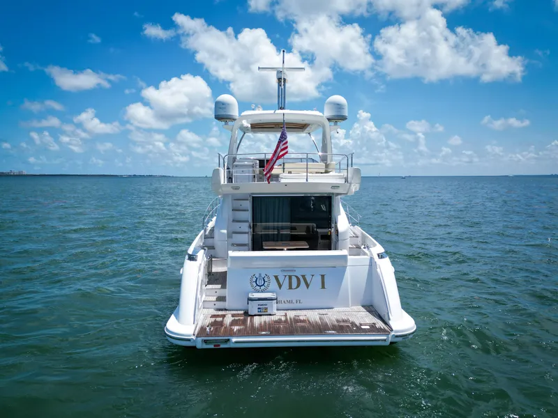 Slide: The Image of Azimut 54 Fly 2015 yacht on open water, rear view with American flag. - 5