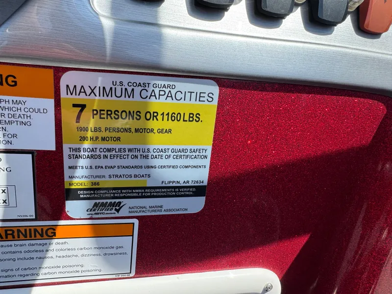 Slide: The Image of Red and gray seat in 2014 Stratos 386 XF boat interior. - 12