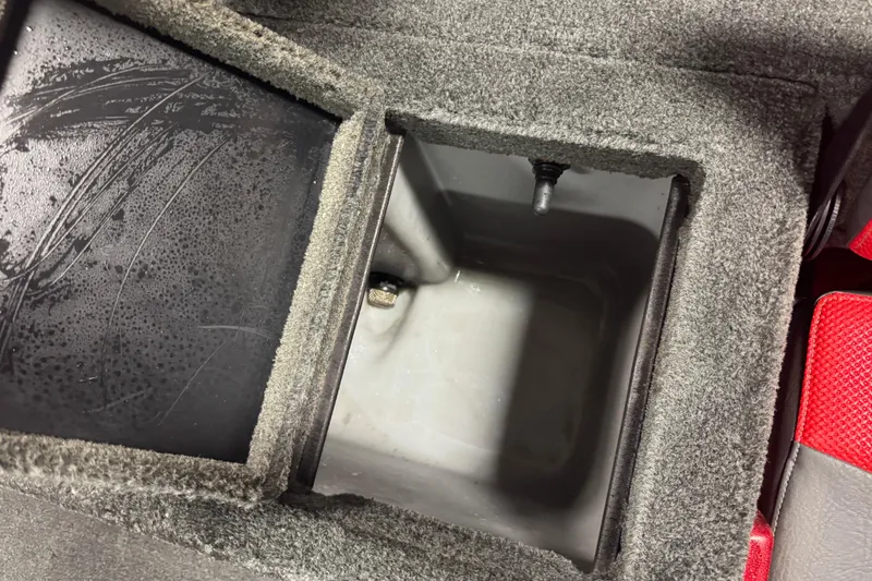 Slide: The Image of Interior compartment of a 2014 Stratos 386 XF, featuring a carpeted storage area. - 17