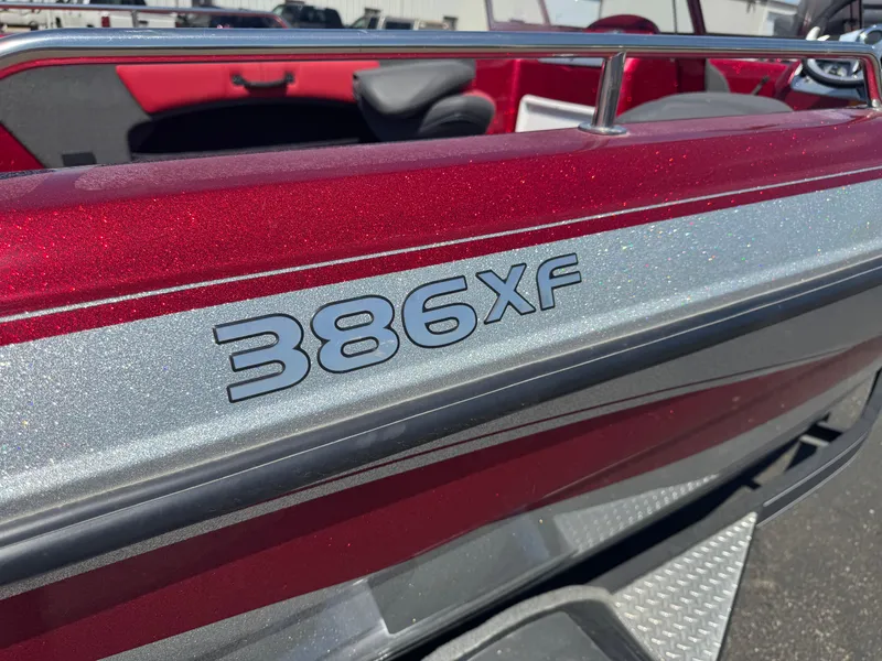 Slide: The Image of 2014 Stratos 386 XF boat with 175 Pro motor in a garage setting. - 5