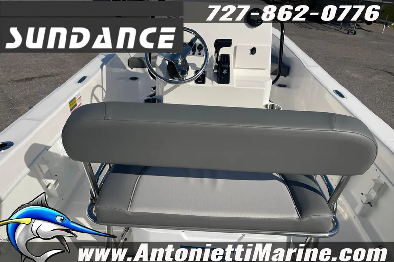 Slide: The Image of 2025 Sundance DX20 boat interior with steering wheel and seating, Antonietti Marine branding. - 12