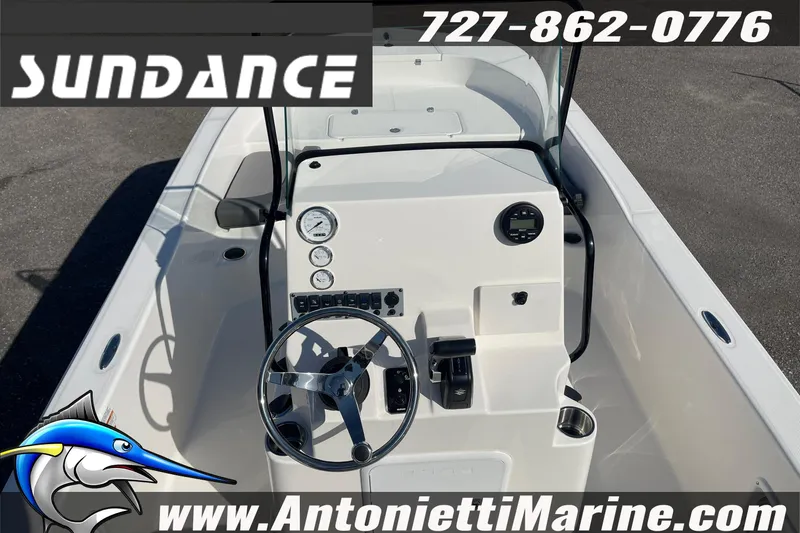 Slide: The Image of 2025 Sundance DX20 boat dashboard with steering wheel and controls, featuring Antonietti Marine branding. - 17
