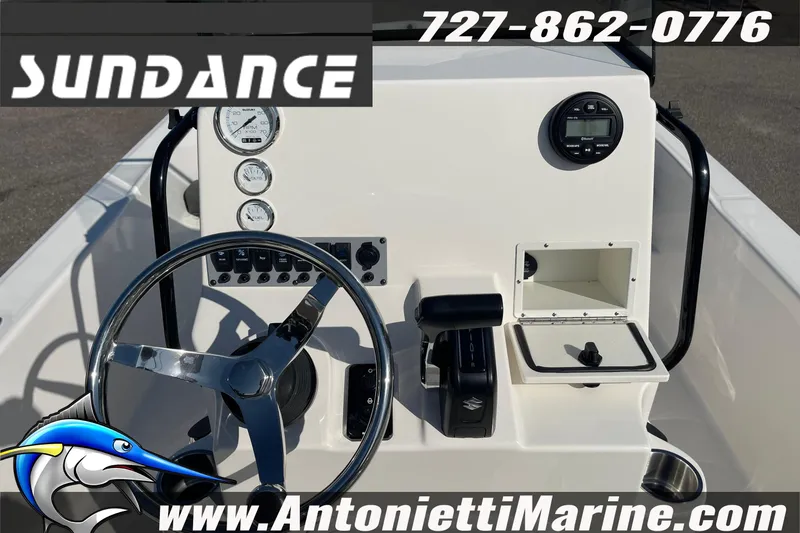 Slide: The Image of 2025 Sundance DX20 boat dashboard with steering wheel and controls, featuring Antonietti Marine branding. - 18