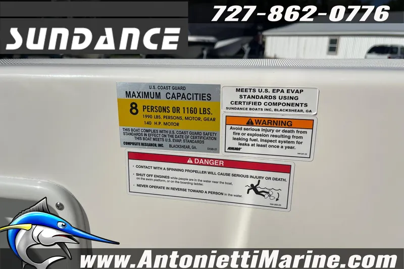 Slide: The Image of Sundance DX20 2025 boat safety labels and warnings, maximum capacity 8 persons or 1160 lbs. - 20