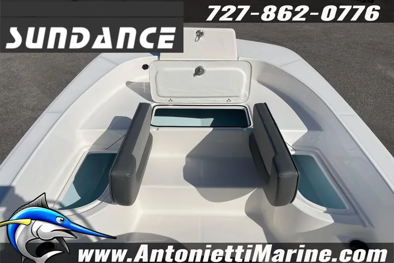 Slide: The Image of 2025 Sundance DX20 boat interior with seating and storage compartments. - 23
