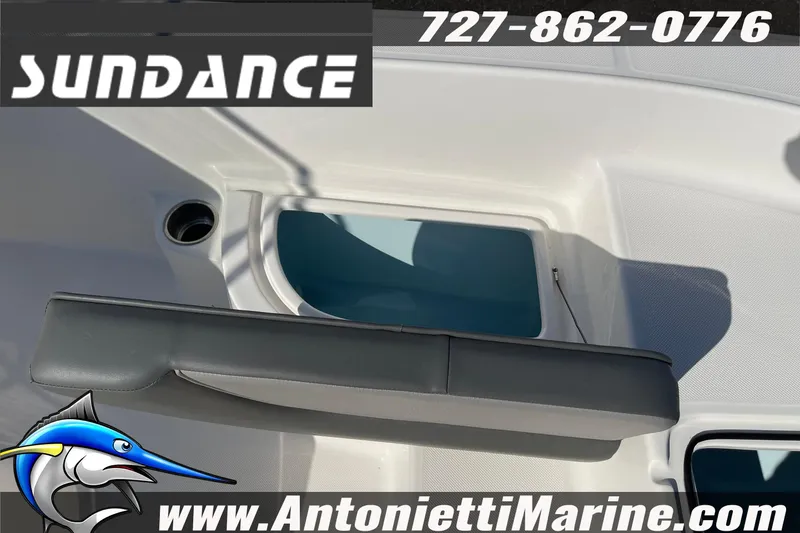 Slide: The Image of 2025 Sundance DX20 boat interior with storage compartment, showcased by Antonietti Marine. - 24