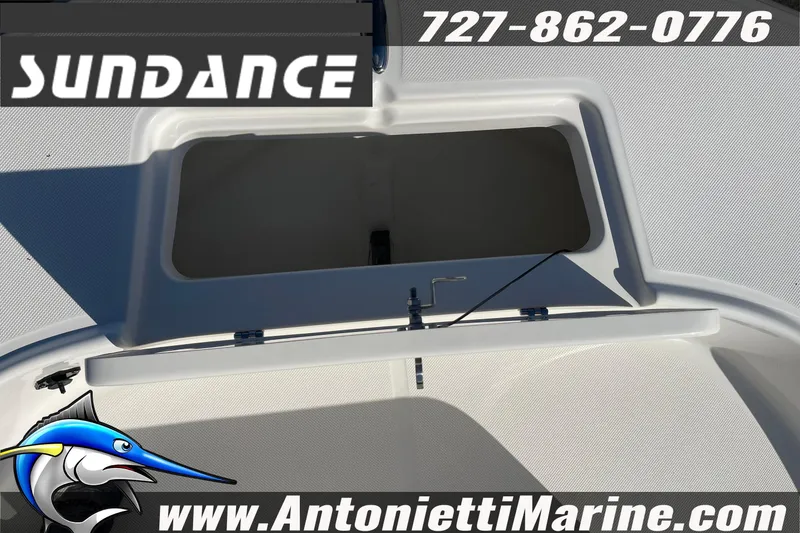 Slide: The Image of 2025 Sundance DX20 boat storage compartment, Antonietti Marine branding, contact number visible. - 26