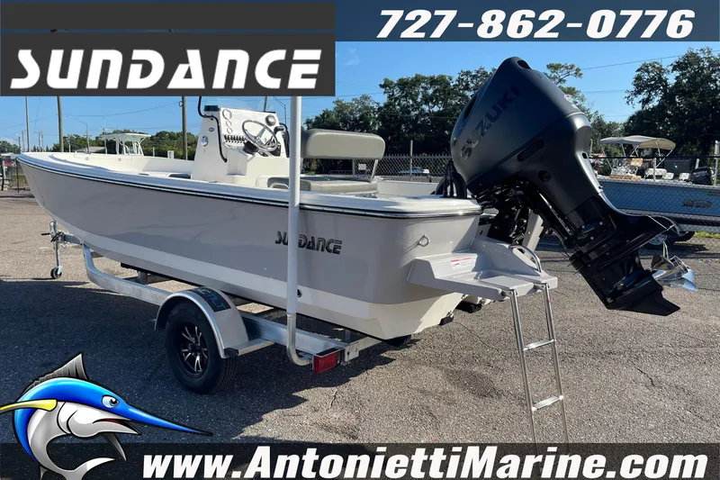 Slide: The Image of 2025 Sundance DX20 boat with Suzuki engine on trailer at Antonietti Marine. - 32