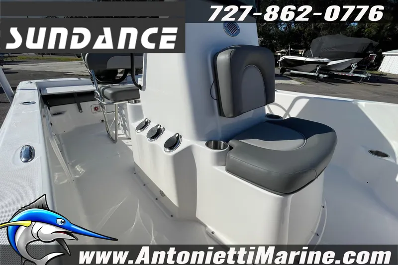 Slide: The Image of 2025 Sundance DX20 boat interior with seating, cup holders, and console. Contact Antonietti Marine. - 4