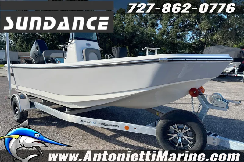 Slide: The Image of 2025 Sundance DX20 boat on trailer at Antonietti Marine dealership. - 7