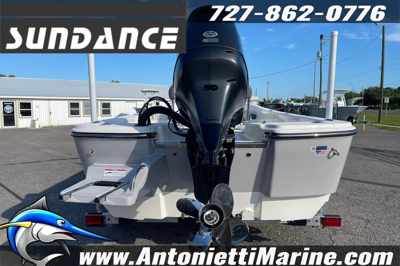 Slide: The Image of 2025 Sundance DX20 boat rear view with outboard motor at Antonietti Marine. - 9