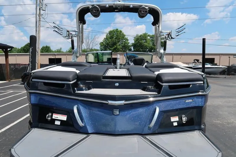 Slide: The Image of 2019 MasterCraft XT22 boat with identification number on sparkling blue hull. - 10