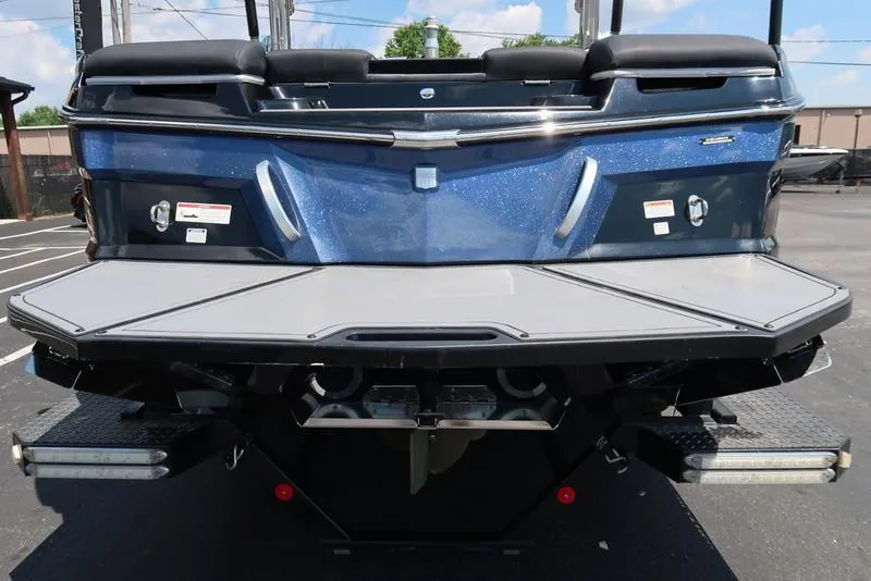 Slide: The Image of 2019 MasterCraft XT22 logo on metallic surface. - 12
