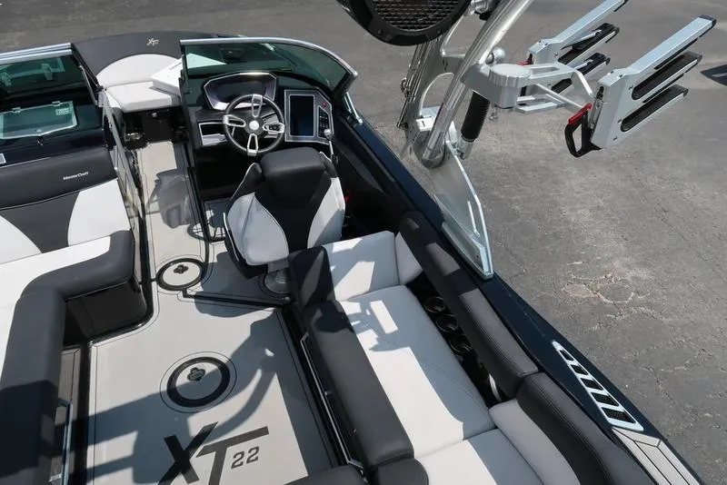 Slide: The Image of 2019 MasterCraft XT22 boat interior with black and white seating. - 15