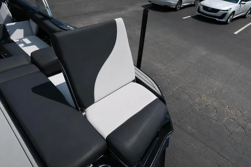Slide: The Image of 2019 MasterCraft XT22 boat interior with sleek seating and modern dashboard. - 19