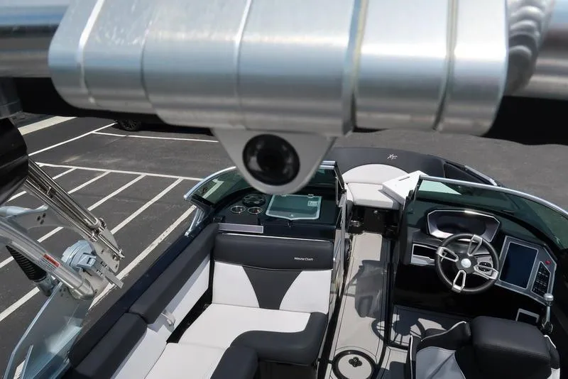 Slide: The Image of 2019 MasterCraft XT22 engine compartment featuring Ilmor engine components. - 22