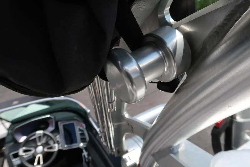 Slide: The Image of 2019 MasterCraft XT22 Ilmor engine badge on a dark surface. - 26