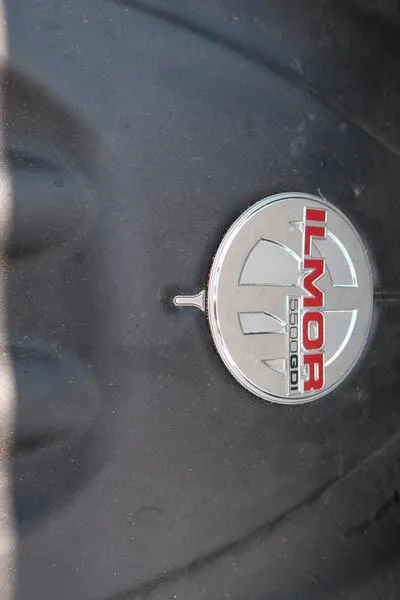 Slide: The Image of Open storage compartment in 2019 MasterCraft XT22 boat. - 27