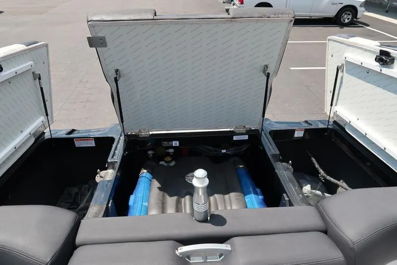 Slide: The Image of 2019 MasterCraft XT22 boat interior with black and white seating and speaker. - 30