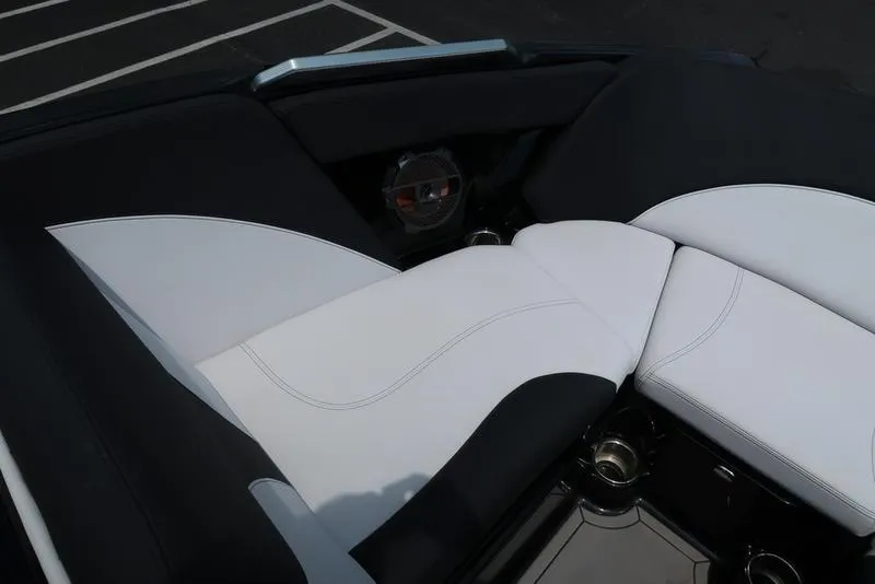 Slide: The Image of 2019 MasterCraft XT22 boat interior with white and black seating. - 31